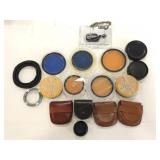 Lot of camera lenses and cases