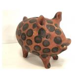 Painted clay piggy bank