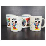 Four ceramic Disney World mugs