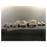 Three pairs of silver toned earrings