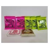 Seven packs of Ernie Ball guitar strings