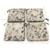 Four black, gray, & white matching chair cushions