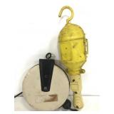 Electric work lamp w/ retractable extension cord