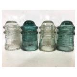 Four Hemingray antique phone line glass insulators
