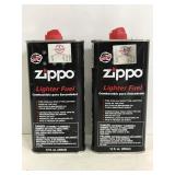 Two containers of zippo lighter fuel