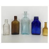 Five old smaller bottles