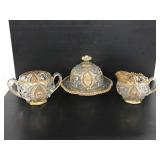 Three cut glass pieces with gold trim