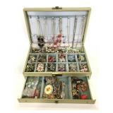 Jewelry box of assorted jewelry and brooches