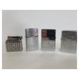 Four metal lighters