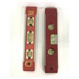Two 9in plastic and metal levels