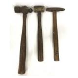 Three assorted wooden handle hammers