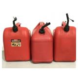 Three assorted red gasoline cans w/ spouts