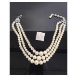 Triple strand pearl necklace and earring set