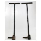 Two green metal farming work handles