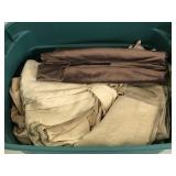 Tote of assorted table linens, curtains, & towels