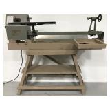 Wood turning lathe on wood stand
