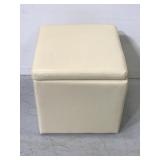 Cream colored vinyl storage ottoman