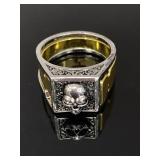 Silver and gold toned stash skull ring