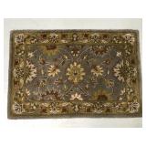 Small accent floral rug