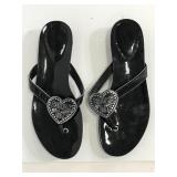 Pair of black Coach Poppy heart flip flops
