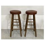 Pair of vintage wood stools w/ vinyl cushion tops