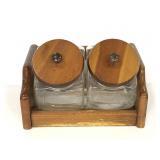 Two glass canisters in wooden caddy