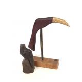 Wooden bird statue and bird display