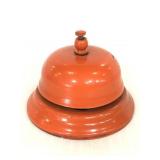 Orange painted metal bell
