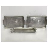 Three metal embossed duck mini trays