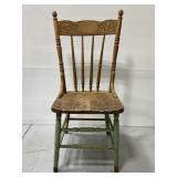 Antique wooden chair w/ carved back
