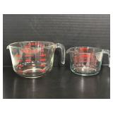 Two Pyrex measuring cups