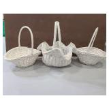 Three painted wicker baskets
