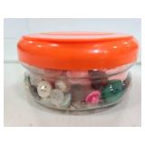 Container of vintage buttons