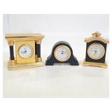 Three mini metal clocks