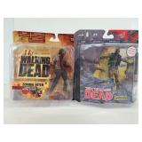 Two walking dead figures in boxes