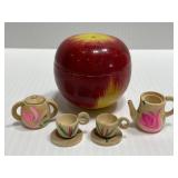 Miniature carved wood tea set in apple
