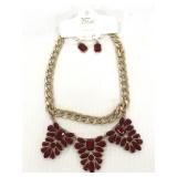 The One gold toned red jeweled earrings/ necklace