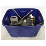 Tote of assorted work tools and supplies