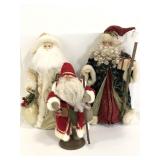 Three St. Nick holiday Christmas statues
