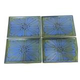 Four matching small plastic trays