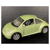 Green Volkswagen Beetle model car on stand