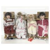 Four new assorted porcelain dolls w/ doll stand