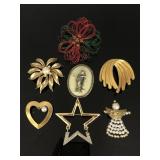 Seven vintage pins/ brooches