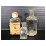 Three small glass bottles