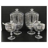 Set of 4 clear plastic candy holders with 3 scoops