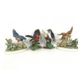 Four porcelain bird figures