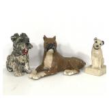 Three small clay dog figures