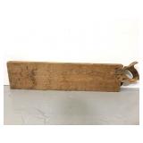 Vintage wood handled saw with wooden sleeve