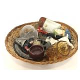 Small woven basket of assorted trinkets