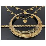 Three gold tone necklaces